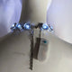 Back view of blue LED chunky rhinestone necklace showing comfortable clasp and battery pack design perfect for all-night wear at weddings and special events