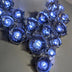 Detailed view of illuminated white rhinestone clusters featuring brilliant LED technology ideal for evening gala events and luxury party accessories with multiple light settings