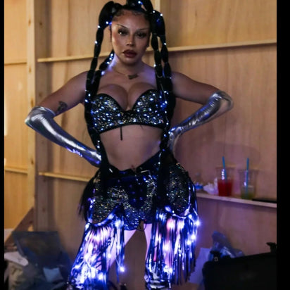 Woman wearing LED Fringe Garter Belt with black outfit - Blue light-up fringe tassels perfect for club nights, Mardi Gras celebrations and bachelorette parties