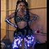 Woman wearing LED Fringe Garter Belt with black outfit - Blue light-up fringe tassels perfect for club nights, Mardi Gras celebrations and bachelorette parties