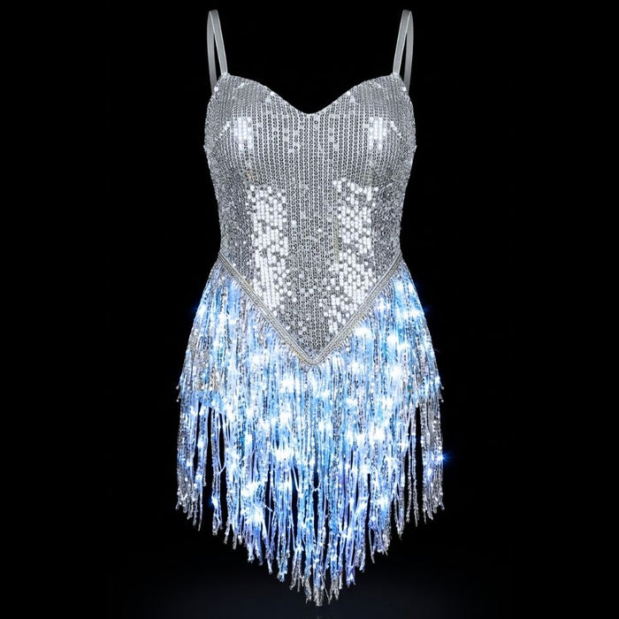 LED Fringe Sequin Dress by Neon Cowboys, a silver light up sequin fringe dress with the fringe hem glowing white on a black background, this led fringe sequin dress, led dress and light up dress with a led bodysuit base is a space cowgirl and showgirl, go-go dancer, burlesque and drag stagewear for raves, EDM concerts, festivals and bachelorette parties, Neon Cowboys