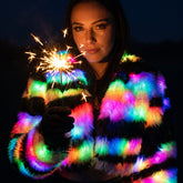 LED faux fur zebra crop jacket lit rainbow, worn at a festival