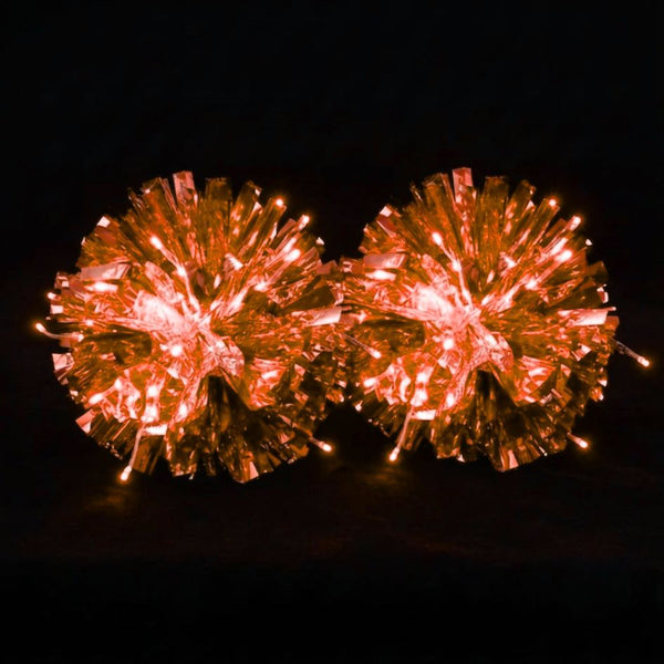 Orange light-up LED pom poms glowing — custom metallic cheer, dance & pom squad pom poms