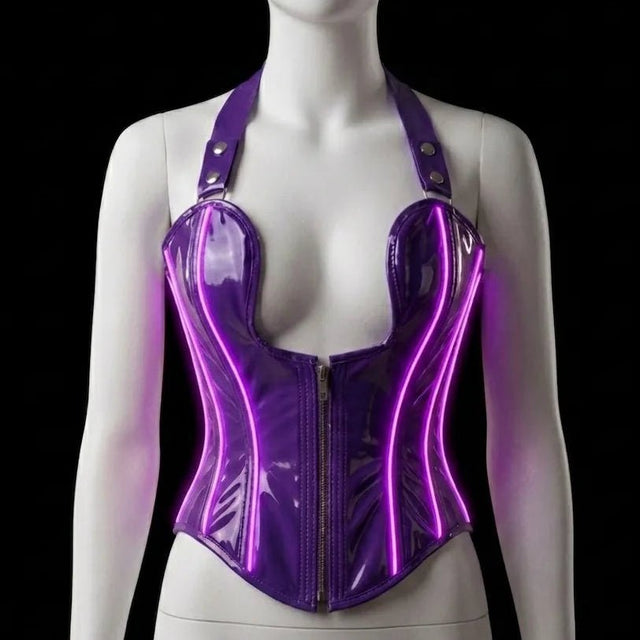 Neon Cowboys purple LED light-up PVC halter corset with vivid magenta glowing neon-wire piping along the boning, zip-front sweetheart halter on a mannequin — made-to-order light-up drag and nightclub corset for Pride performers, witchy gothic looks and galaxy bachelorette parties, glowing club wear by Neon Cowboys