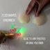 Two glowing red LED cherry shapes next to silicone pasties — light-up cherry nipple covers you glue onto any pasties or bra