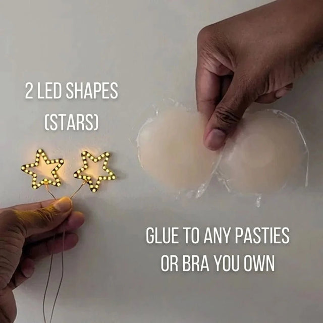 Two glowing gold LED star shapes next to silicone pasties — light-up star nipple covers you glue onto any pasties or bra