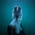 LED Rhinestone Gem Head Piece glowing under blue stage light — a color-changing light-up crystal headpiece with draping rhinestone strands that frame the face, a statement showgirl crown for burlesque, drag, cirque and festival performers.