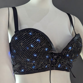 Black LED sequin light up bra on female form showing elegant dark design with blue illuminated accents perfect for nightlife events and evening parties