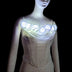 A white rose corset on a mannequin with LED light up roses glowing cool white, a light up corset and LED rose corset stagewear for go-go dancers, burlesque performers, brides and festival dancers at raves, weddings, and music festivals, Neon Cowboys LED rose corset, Neon Cowboys