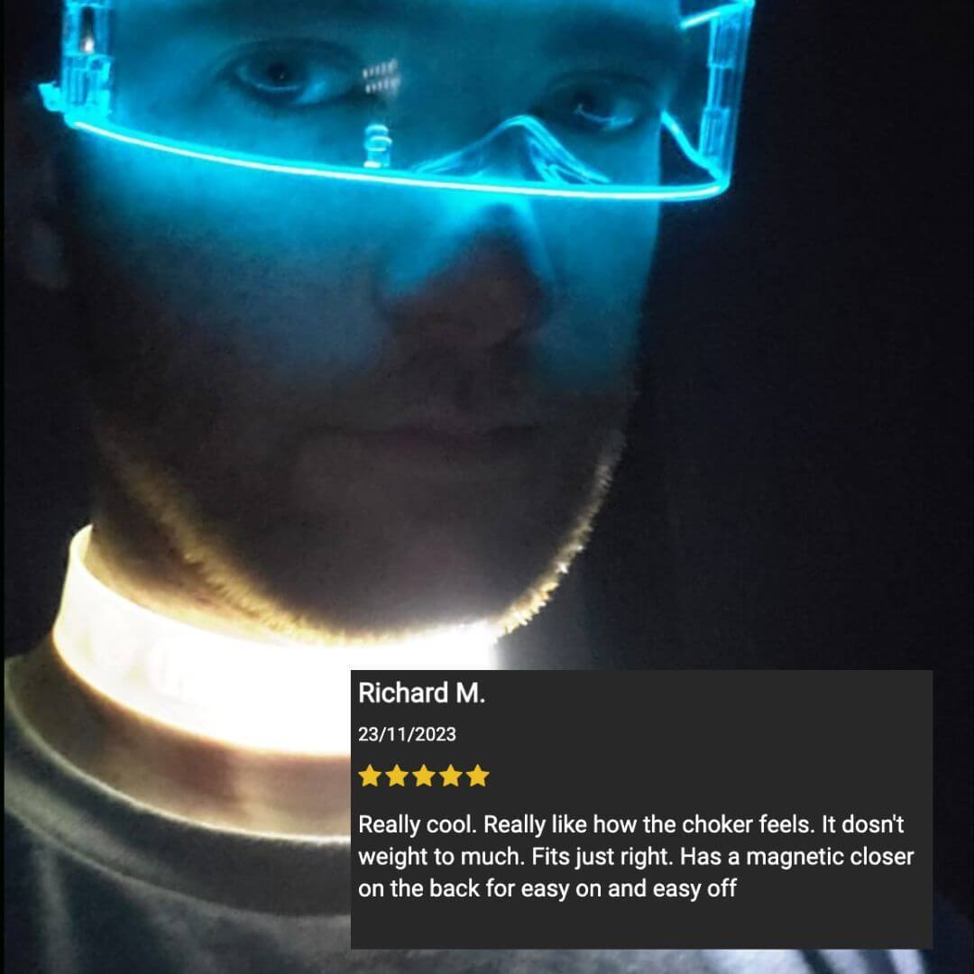 Glowing blue WANTED light up LED choker on person's neck at dark nightclub party costume accessory that adds unique festival style to any concert outfit for women attending themed events