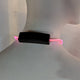 Close up of pink light up bolo tie battery pack showing compact design and easy operation for convenient wearable lighting technology