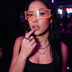 Woman in orange glowing LED cyber glasses at a neon-lit nightclub, futuristic light up glasses and cyberpunk led glasses for raves, music festivals, EDM concerts, nightlife, and Halloween costumes, Neon Cowboys
