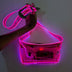 Hand holding glowing pink fanny pack showing transparent stadium approved design ideal for concerts and security-compliant venue entry