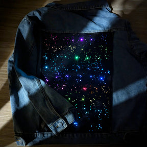 Galaxy Denim Jacket Lighting Effect Detail - Close-Up of LED Light Pattern - Color Changing Jean Jacket for Concerts and Parties - Neon Wearable Fashion Technology