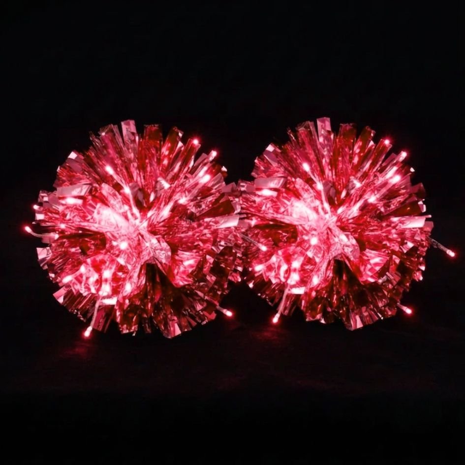 Glowing red LED light-up pom poms lit up in the dark — a rechargeable, remote-controlled color-changing pair of cheerleading pom poms for game day, dance and raves.