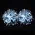 Glowing silver LED light-up pom poms lit in the dark — a rechargeable, remote-controlled color-changing pair of cheerleading pom poms for game day and dance.