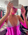 A woman in a rhinestone cowboy hat and glowing hot pink light up LED PVC corset in a lit dressing room backstage, a custom made to order light up corset and led corset, glowing stagewear and a performance outfit for go-go dancers, burlesque performers and drag at raves and festivals, Neon Cowboys