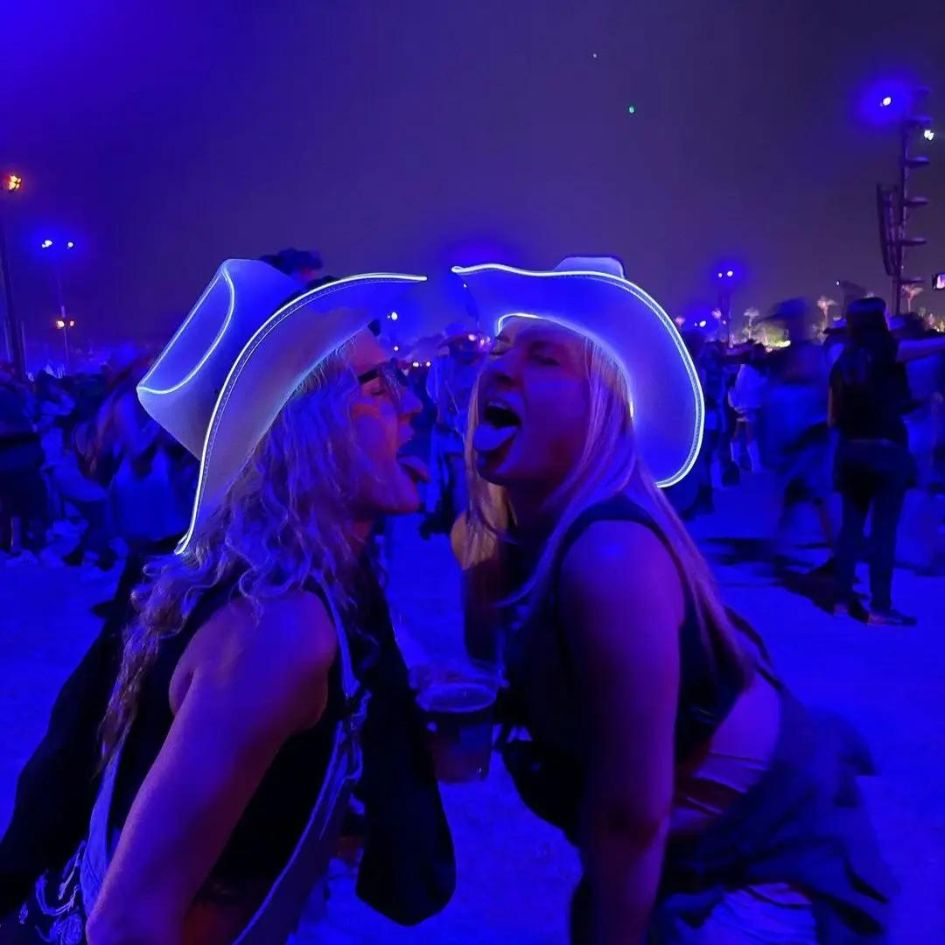 White LED Cowboy Hats at Music Festival - Women Friends Celebrating at Night Concert with Light Up Cowgirl Hats - EDM Rave Party Accessories