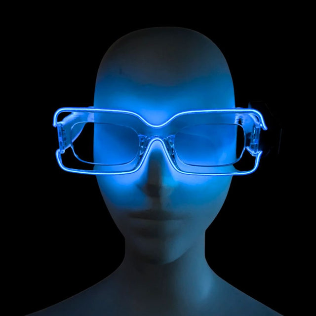 Side view of blue glowing LED light up transparent party sunglasses on a white mannequin head, futuristic festival sunglasses and cyberpunk led glasses for raves, EDM concerts, and glow parties, Neon Cowboys