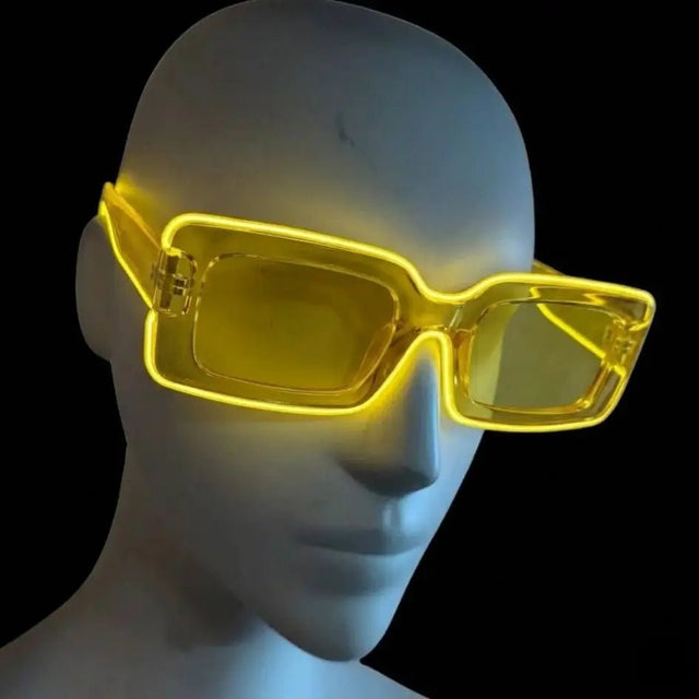 Yellow glowing LED light up square party sunglasses shown on a mannequin head against a black background, illuminated futuristic party glasses and festival sunglasses for raves, EDC, and costume parties, Neon Cowboys