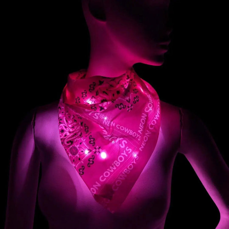 Mannequin wearing a pink glowing LED light-up bandana with the Neon Cowboys paisley print, light up cowgirl accessory and led bandana for Nashville and Las Vegas country bachelorette parties, glow western fashion and space cowgirl costumes, Neon Cowboys