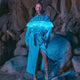 Model wearing illuminated blue denim dress with glowing ruffle trim perfect for country music festivals western themed parties and rodeo events