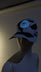 Black and white cowprint baseball cap with a glowing blue Neon Cowboys logo on a mannequin head