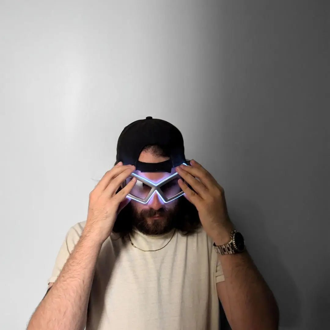 Male Wearing Silver Glowing Space Sunglasses - LED Party Eyewear in Action - Illuminated Space Cowgirl Accessory for Festivals and Nightlife Events - Futuristic Halloween Costume
