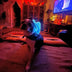 Dog wearing blue LED cowboy hat in nightclub setting - Light-up pet accessory perfect for evening events and nightlife
