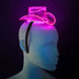 Pink glowing LED light-up mini cowboy hat shown on a headband on a mannequin head, a neon cowgirl hat and space cowgirl accessory for raves, music festivals, bachelorette parties and Halloween costumes, Neon Cowboys