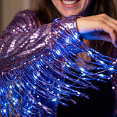 Purple LED fringe jacket close-up — glowing sequin fringe