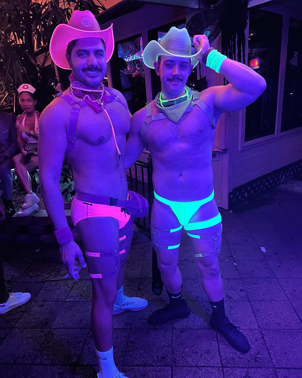 Nightlife performers in Neon Cowboys LED light-up cowboy hats