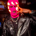 Person in leather jacket wearing pink LED balaclava - Cyberpunk illuminated mask for underground clubs, DJ performances, fashion-forward streetwear, and viral content creation