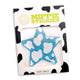 Packaged star-shaped nipple stickies with cow print packaging showing blue holographic design for rodeo outfits and country western parties