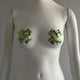 Woman wearing star-shaped nipple stickies in natural light showing daytime appearance of glow in the dark western accessories