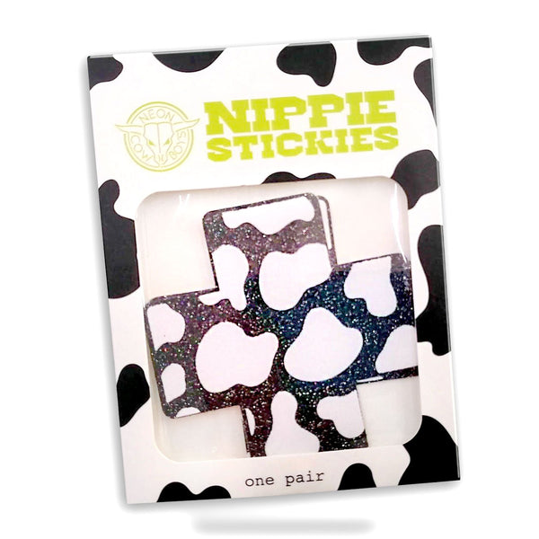 Packaged heart-shaped nipple stickies with cow print border showing retail presentation for festival accessories and western-inspired party wear