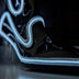 A close-up of a black light up boot pointed toe with a bright white glowing outline, this Out Past Midnight light up cowgirl boot and light up heel is made for raves, festivals and evening events, Neon Cowboys