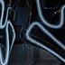 A close-up of black light up boots with white glowing outlines and clear block heels, these Out Past Midnight light up cowboy boots and light up heels are made for raves, music festivals and nightclub nights, Neon Cowboys
