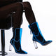 Black transparent boots with blue LED lighting against white background showing contrast between dark material and vibrant illumination