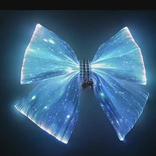 Real video of a Neon Cowboys LED cheer bow changing color: blue, green, lilac and light blue