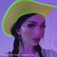 Lightning bolt LED face stickers video for Lollapalooza music festival makeup looks paired with LED neon cowboy hat in green