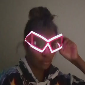 LED Space Sunglasses Video - Woman Wearing Light Up Eyewear - Illuminated Glowing Space Cowgirl Glasses at Night Events for Halloween Costumes and Mardi Gras