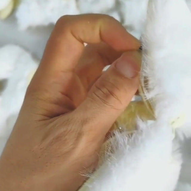 Video how to use light up LED fuzzy butterfly hair clip - Tutorial showing proper application technique for secure styling before festivals, concerts, photoshoots, and daily wear
