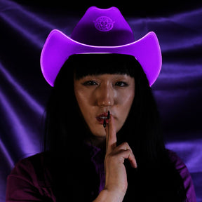 Purple space cowgirl hat with LED lights glowing for royal themed parties princess celebrations and western costume luxury events