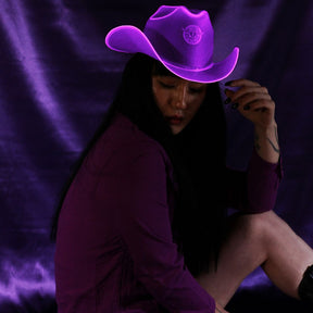 Purple neon cowboy hat with bright LED lights perfect for lavender aesthetic photoshoots Instagram styling and western fashion