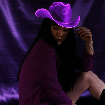 Purple neon cowboy hat with bright LED lights perfect for lavender aesthetic photoshoots Instagram styling and western fashion