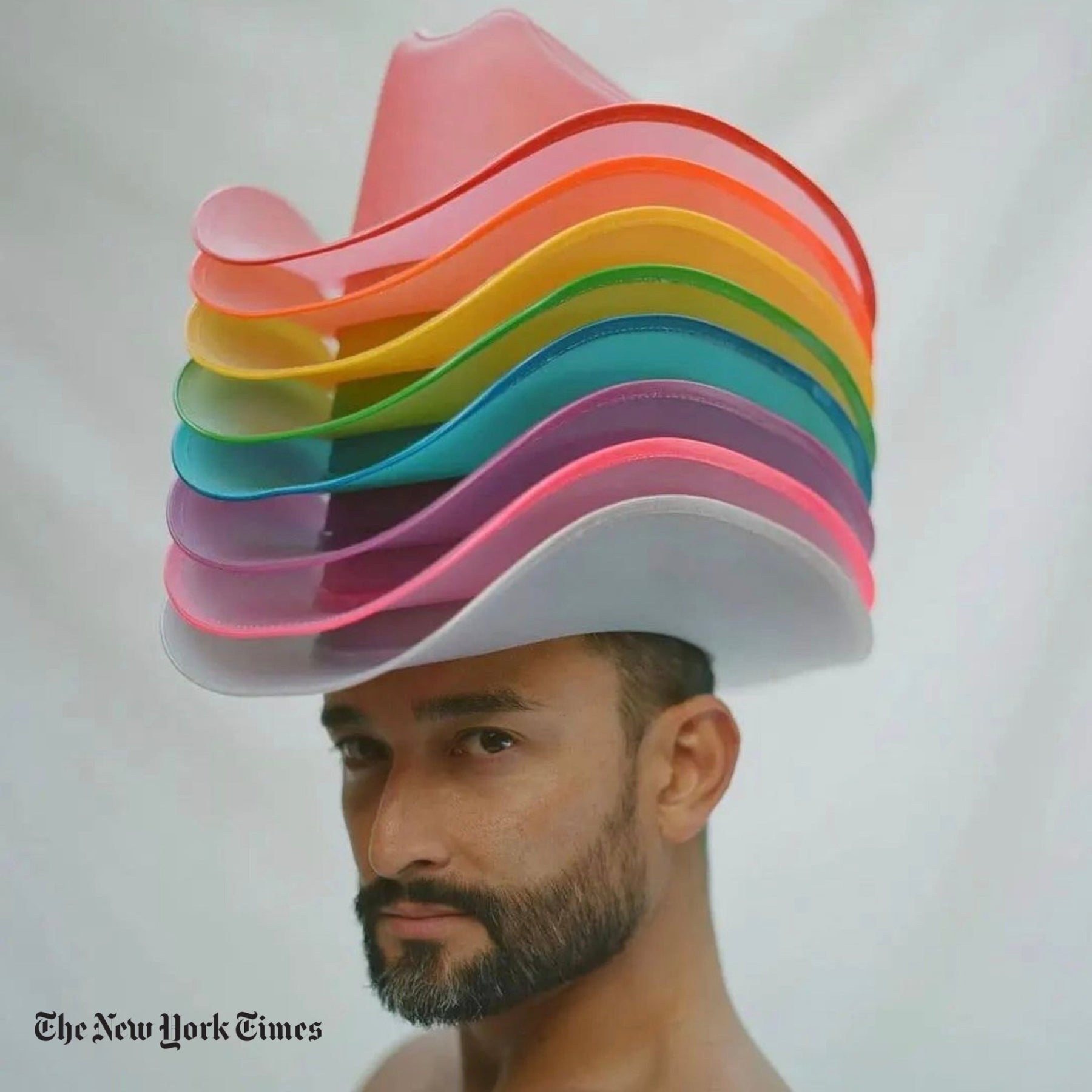 Mark Kanemura Man wearing rainbow light up cowboy hat featured in New York Times showcasing illuminated western fashion for pride celebrations and LGBTQ+ rodeo events
