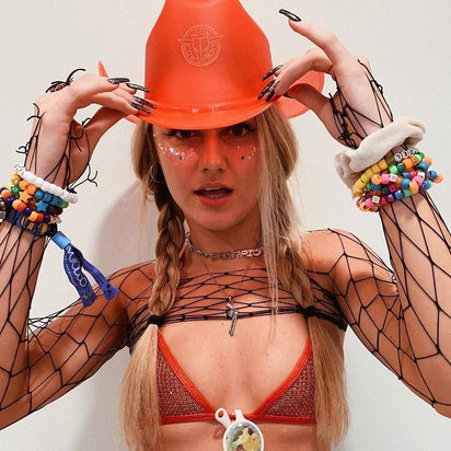 Red LED neon cowgirl hat glowing bright for luxury yacht parties summer events and western costume fashion celebrations