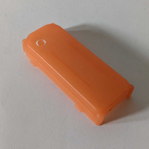 Replacement Battery Cover for the light up hat, an orange plastic battery cover for the light up hat on a white background, a spare replacement part for the LED cowboy hat battery pack to keep your neon cowboy hat glowing at festivals, concerts and parties, Neon Cowboys