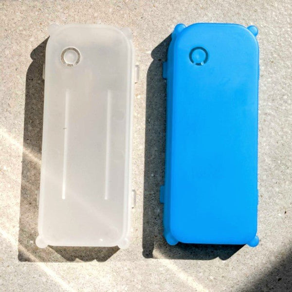 Replacement Battery Cover for the light up hat, clear and blue hat battery covers side by side on concrete, spare replacement parts for the LED cowboy hat battery pack to keep your neon cowboy hat glowing at festivals, concerts and parties, Neon Cowboys